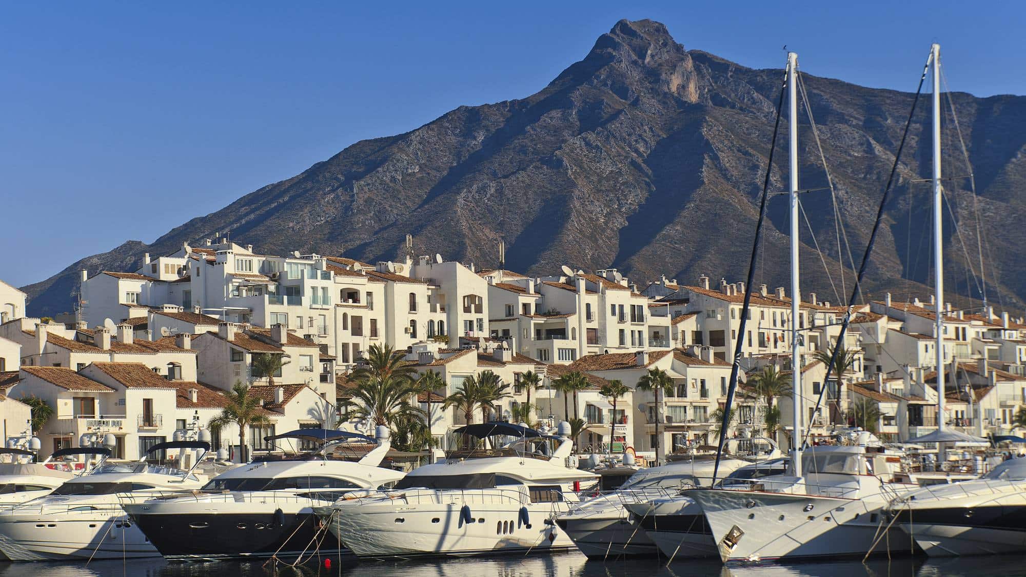 Puerto Banús marina and white apartments beneath La Concha mountain, Marbella